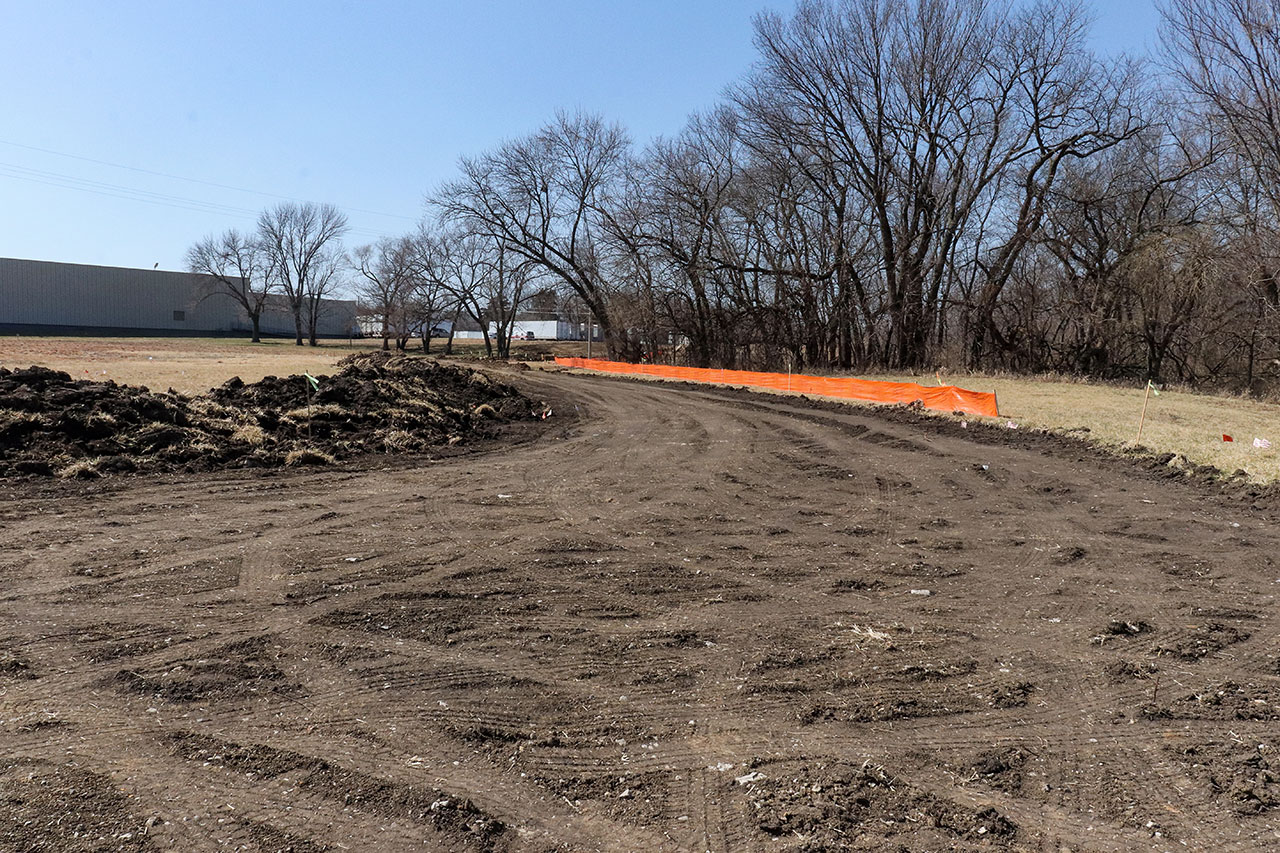 A cleared dirt path on the new section of the Lawrence Loop north of the Hallmark production facility