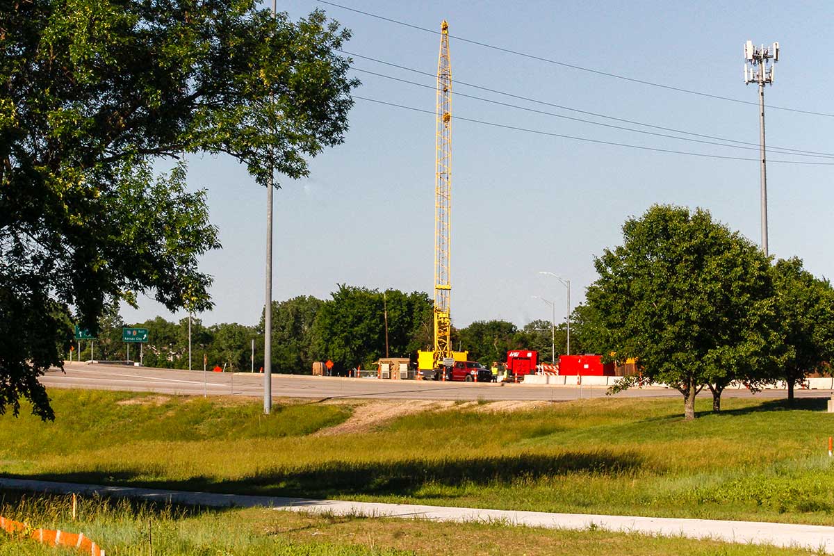 A crane and other equipment on the turnpike entrance road