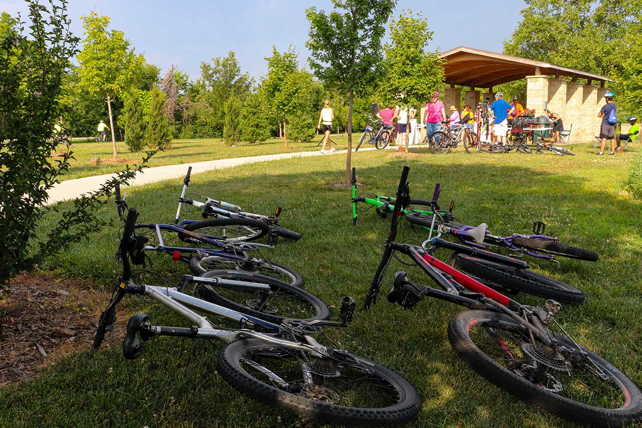 People at the Lawrence community bike ride with bikes in the foreground
