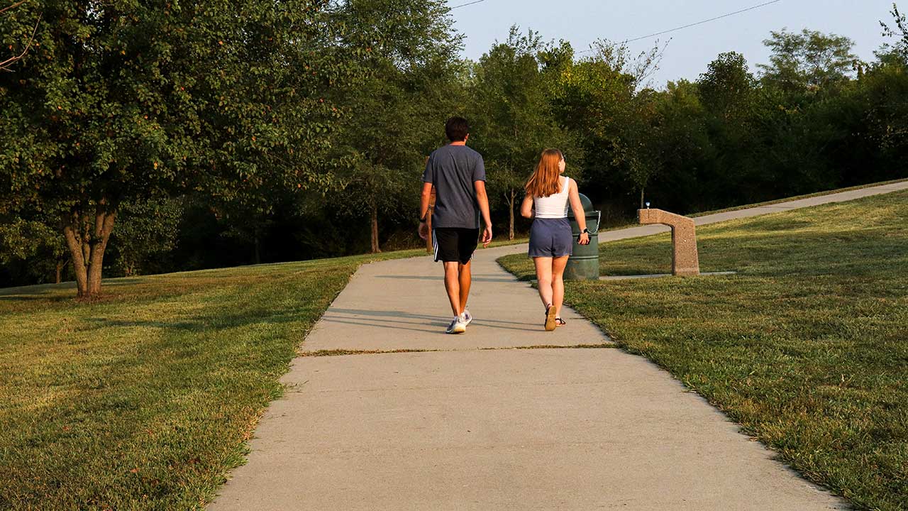 A couple walking on the trail