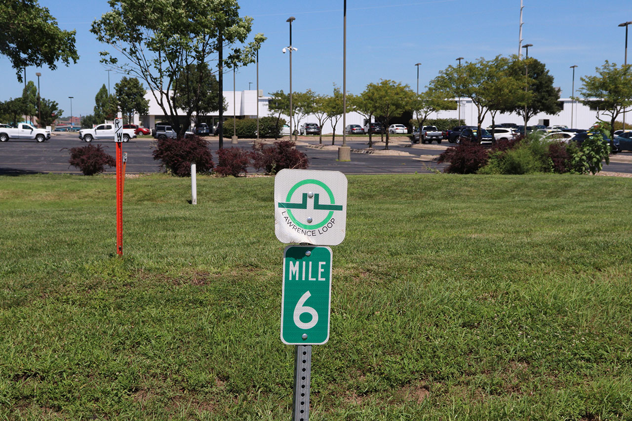 Mile marker 6 is by Crown Automotive near the Iowa St crossing