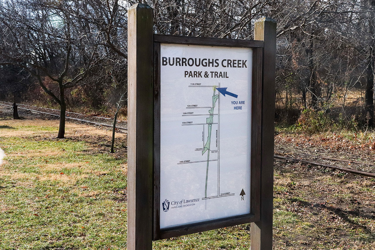 The Burroughs Creek sign at 11th Street
