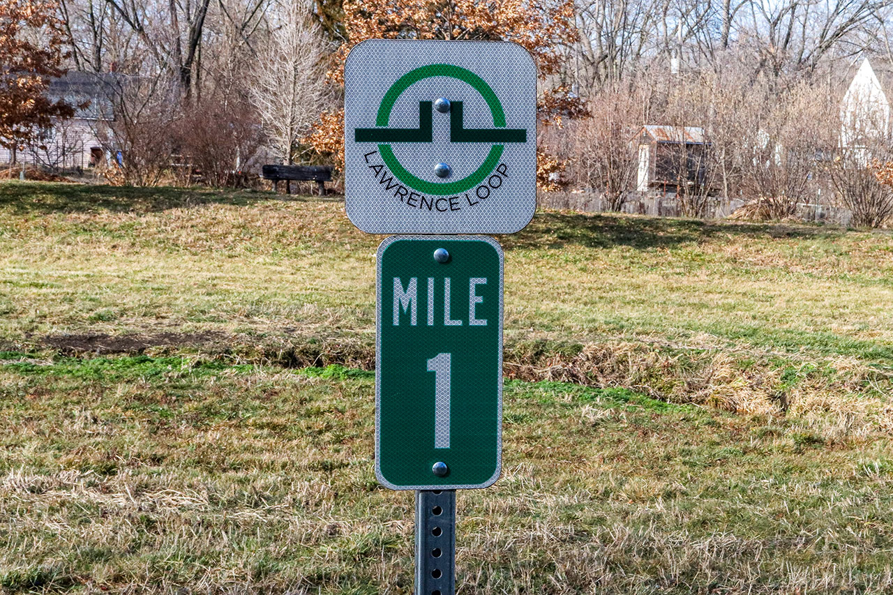 The Lawrence Loop Mile Marker 1 located on the Burroughs Creek Trail