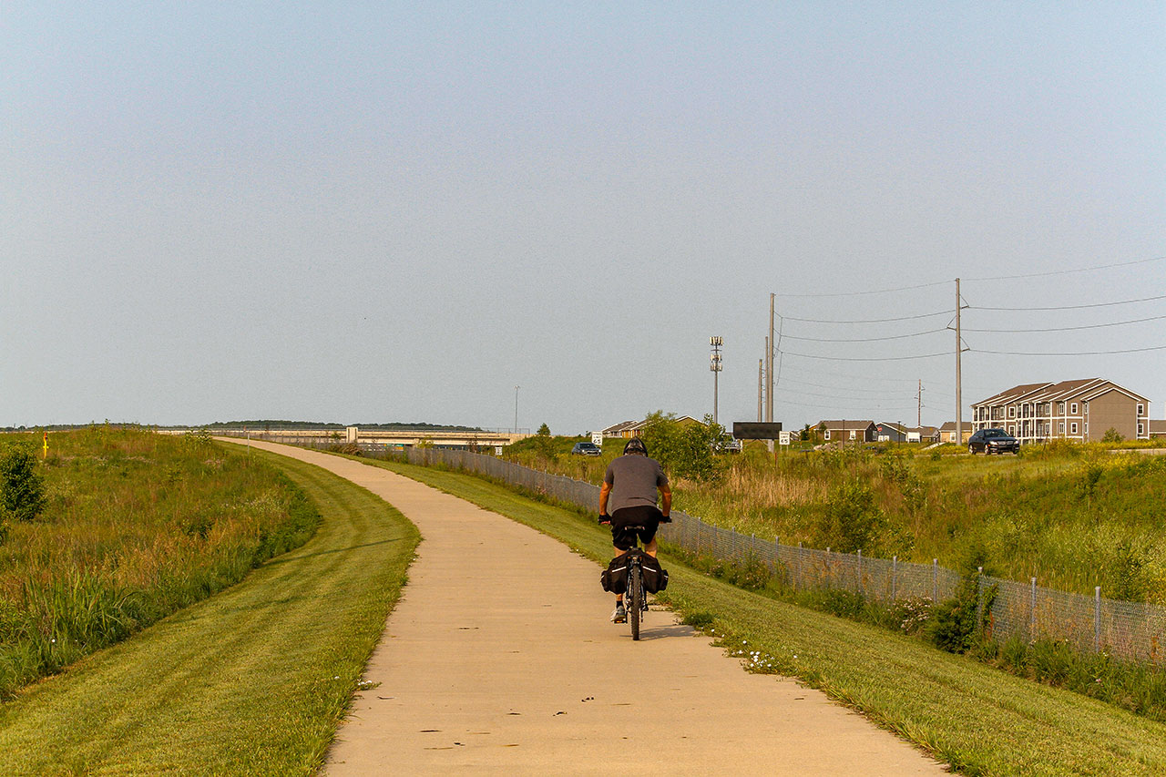 A man biking on the Loop going toward Michigan St