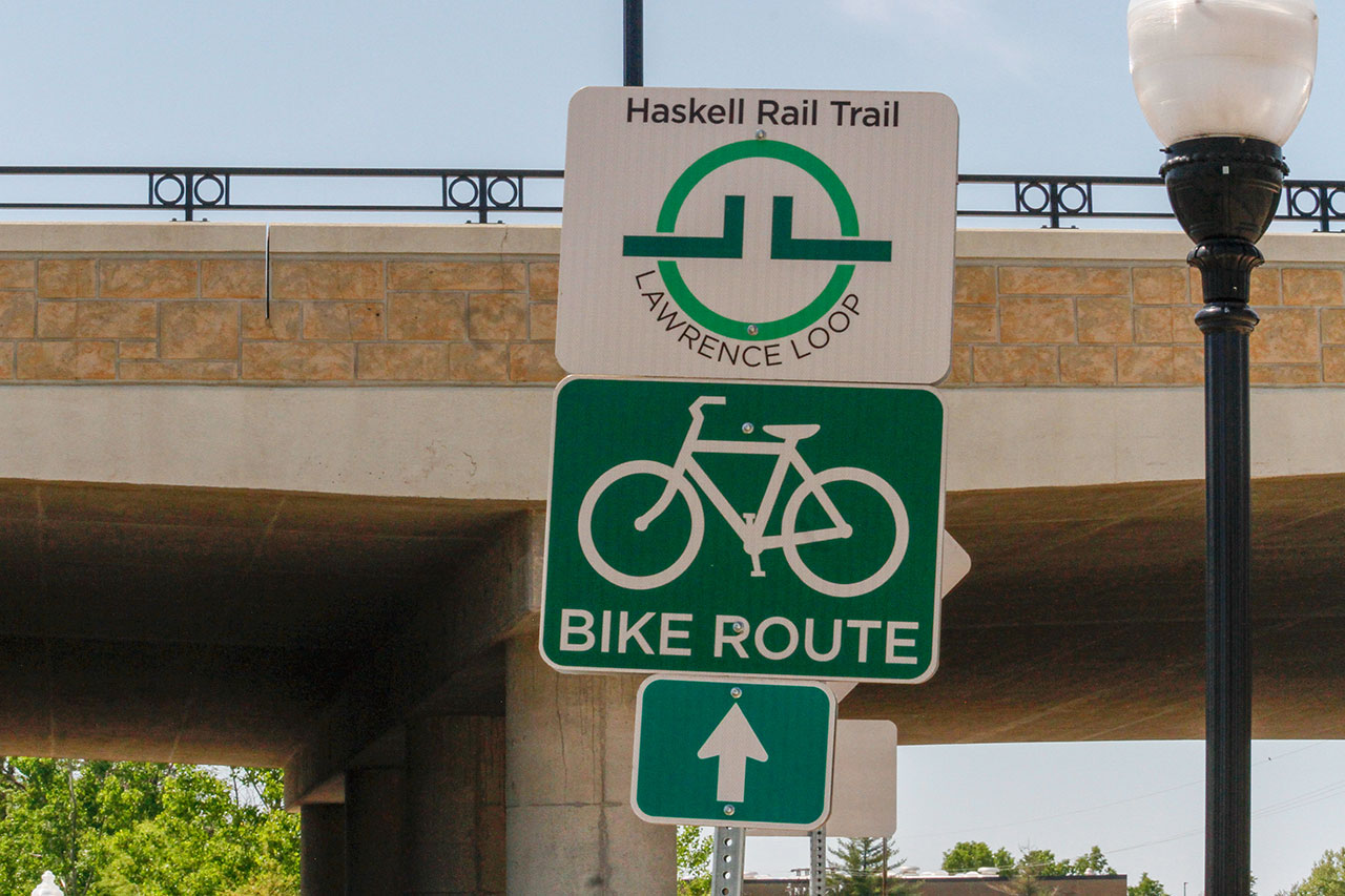 A Haskel Rail Trail sign along the trail under the 23rd Street Bridge