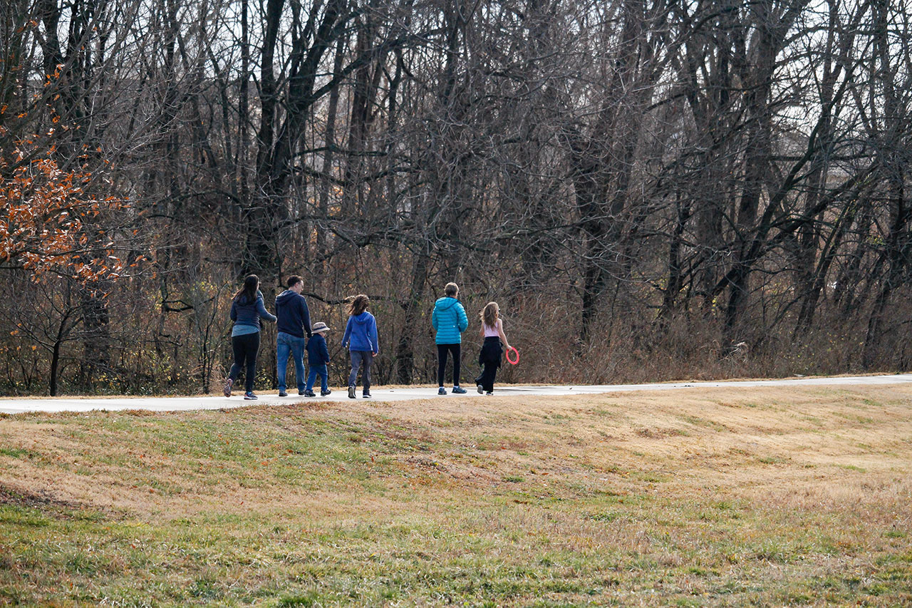 A group of people walkin on the trail