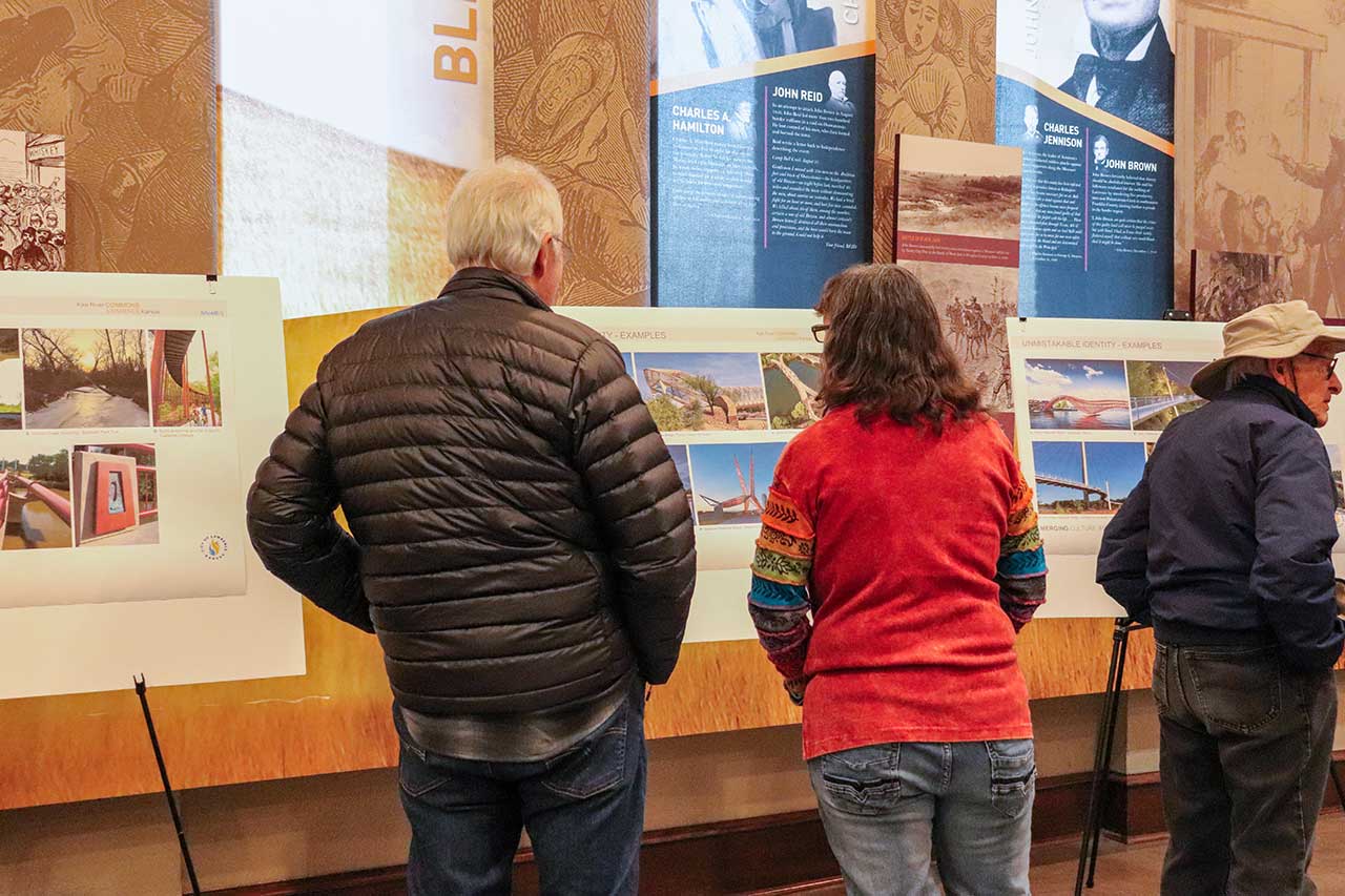 People at the Open House looking at the displays