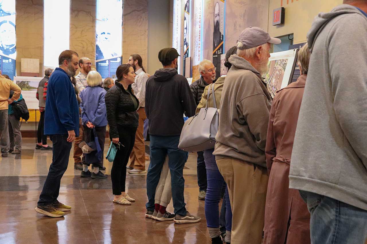 People at the Open House looking at the displays