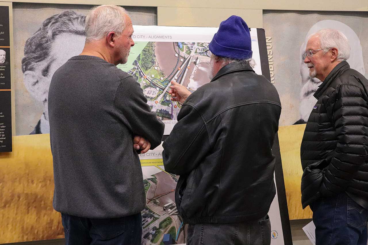 People at the Open House looking at the displays