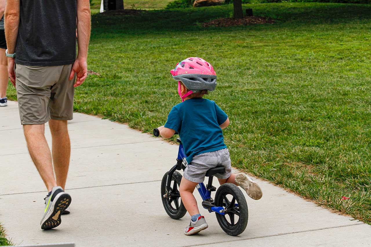 A cute little boy on his bike