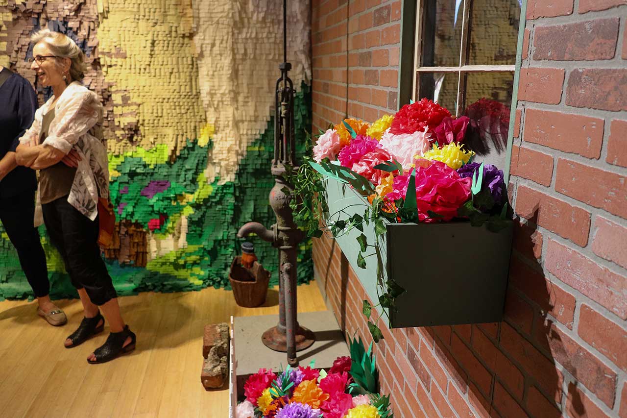 The paper flowers created by family members in the exhibit