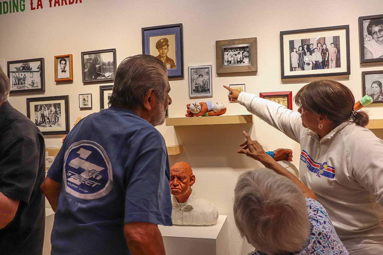 Family members viewing the exhibit