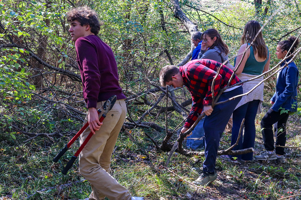 Students working to clear the trail