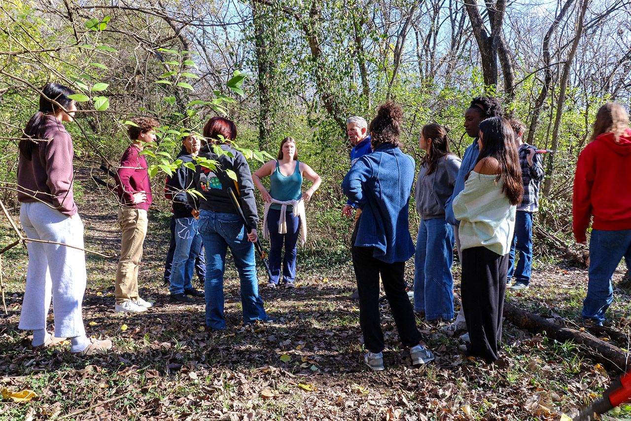 The students gather with their teacher, Eric Nelson to assess their work