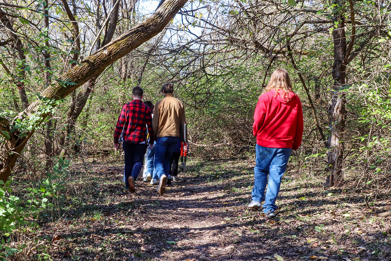 Students walking the trail to begin their work