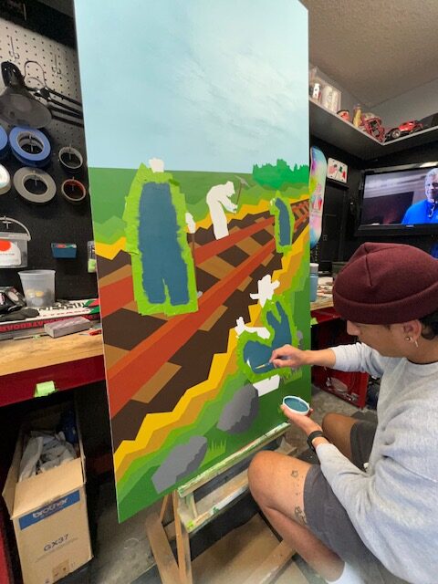 Javy Ortiz painting a LaYarda panel