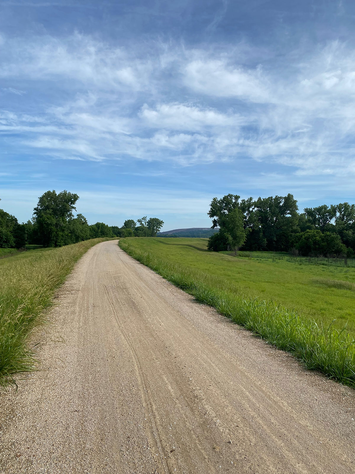 The levee trail is packed gravel and 10ft wide