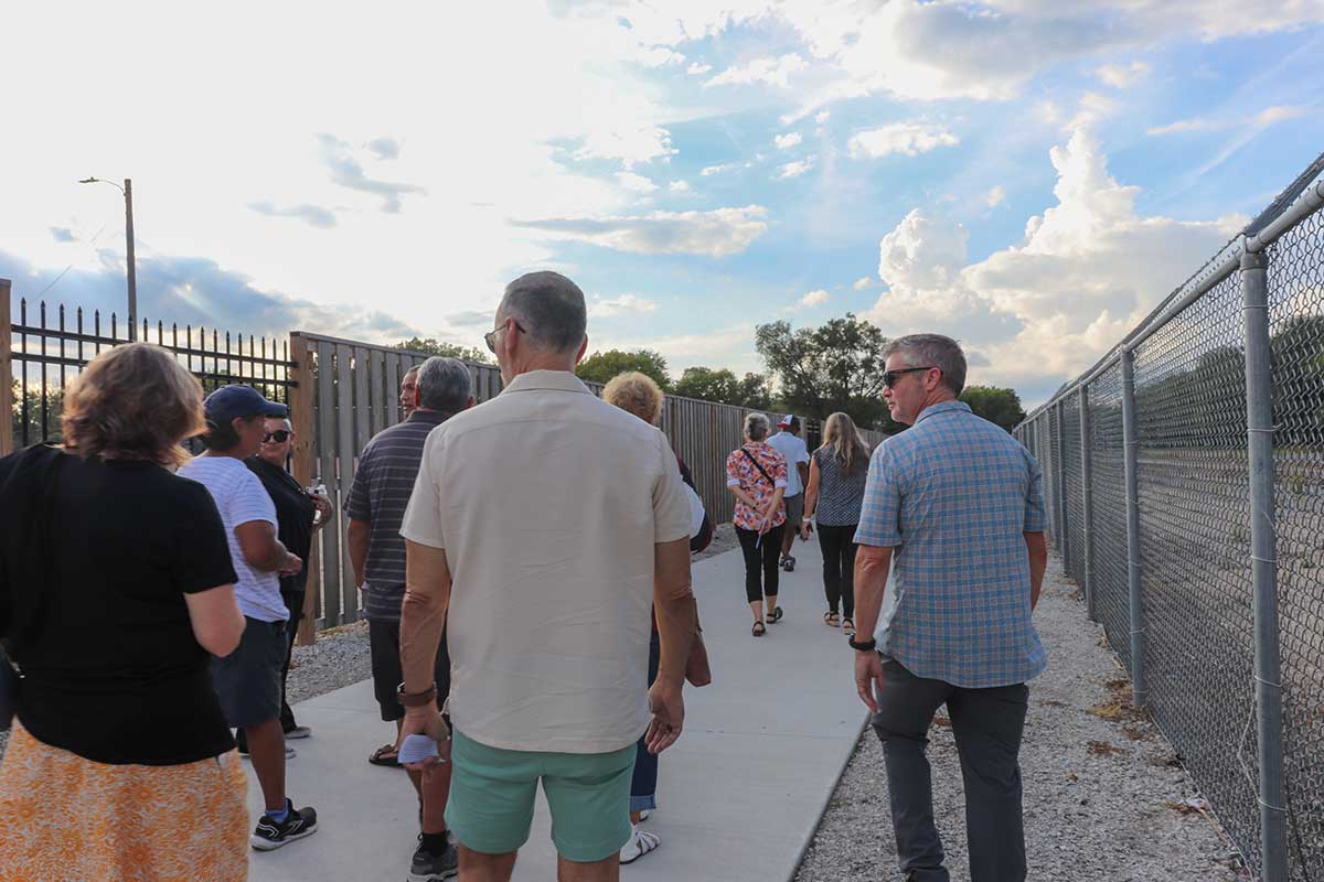 The crowd walked down the Loop and admired the art works along the way