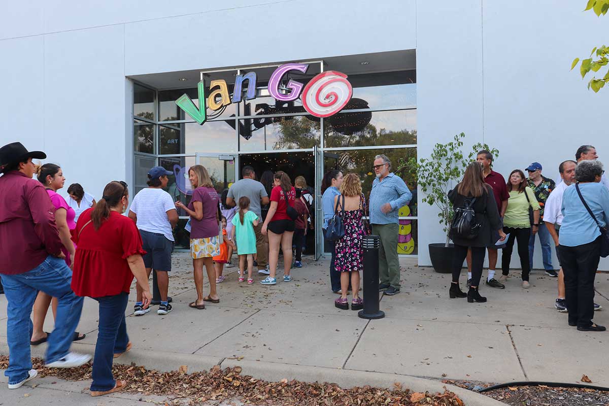 People entering Van Go for the party