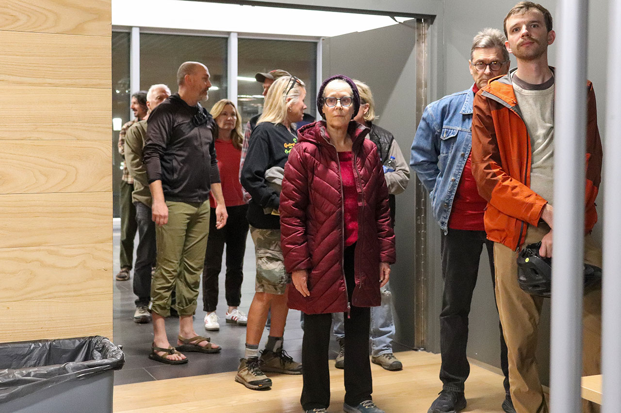 people arriving at the cameron's bluff open house