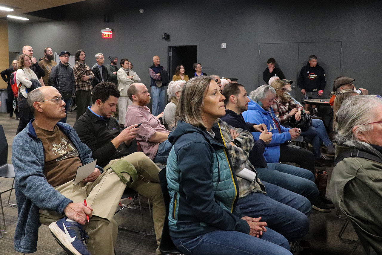 people listing to the presentation at the cameron's bluff open house