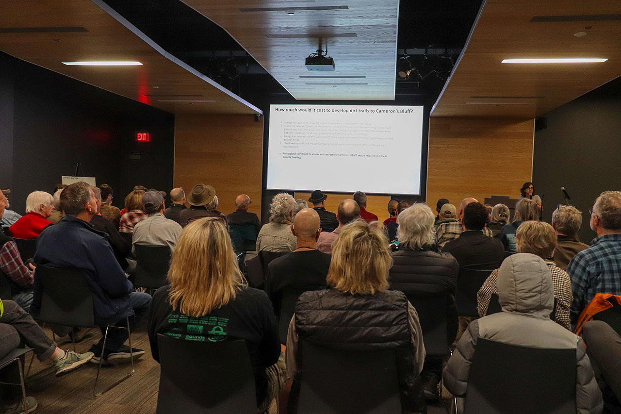 people listing to the presentation at the cameron's bluff open house