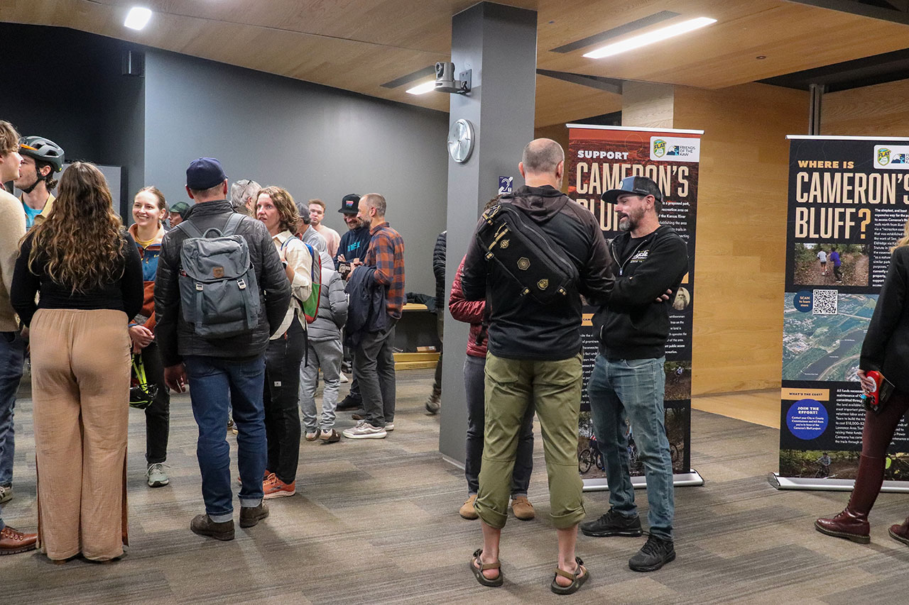 people discussing cameron's bluff at the open house