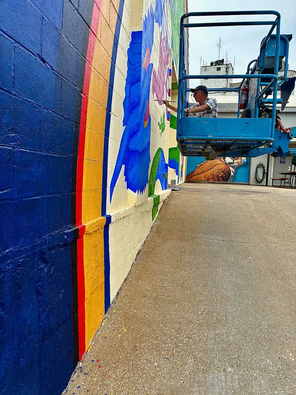 Dave Lowenstein painting the mural