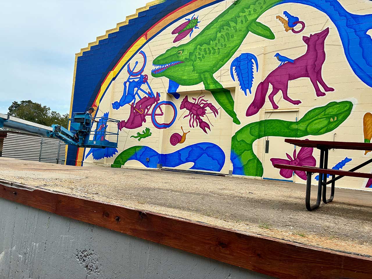 Dave Lowenstein painting the mural