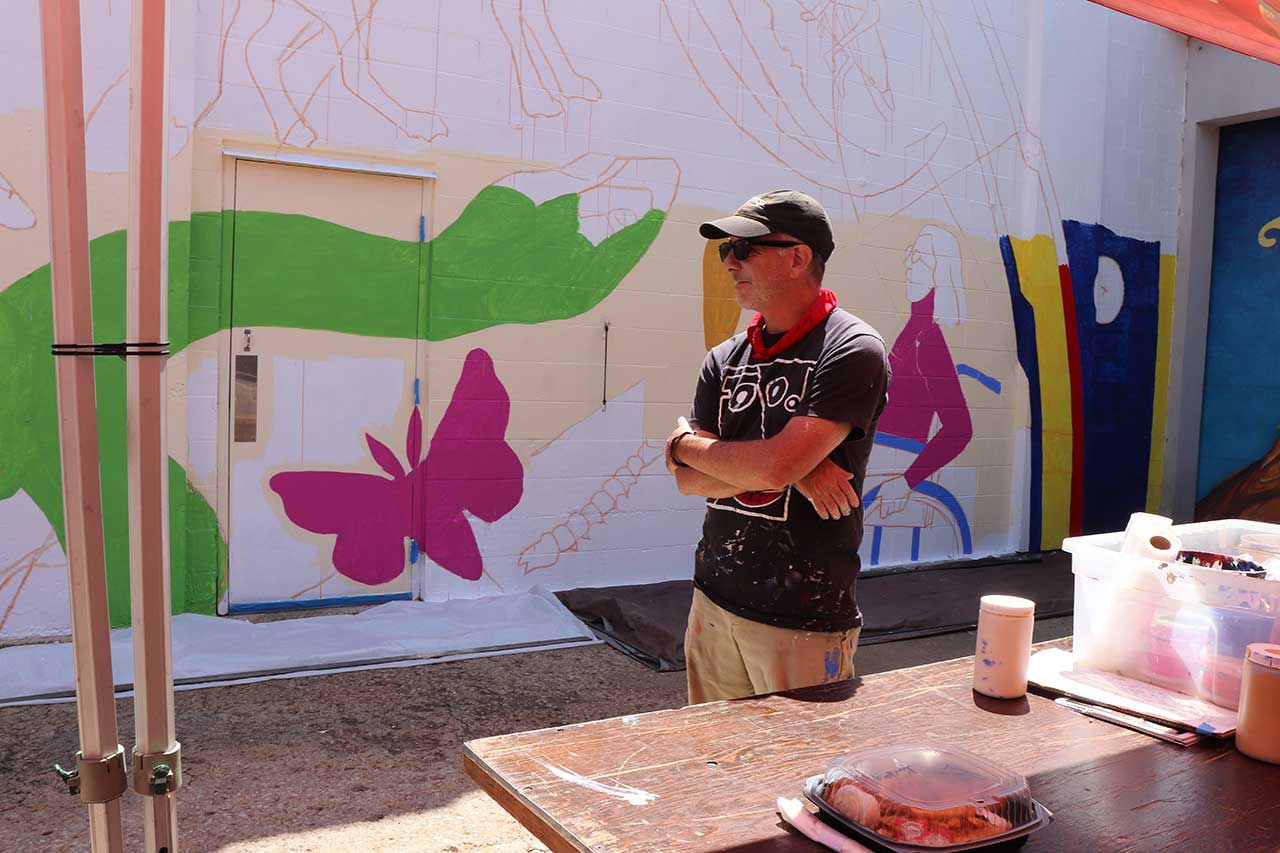 Artist Dave Lowenstein at the painting party
